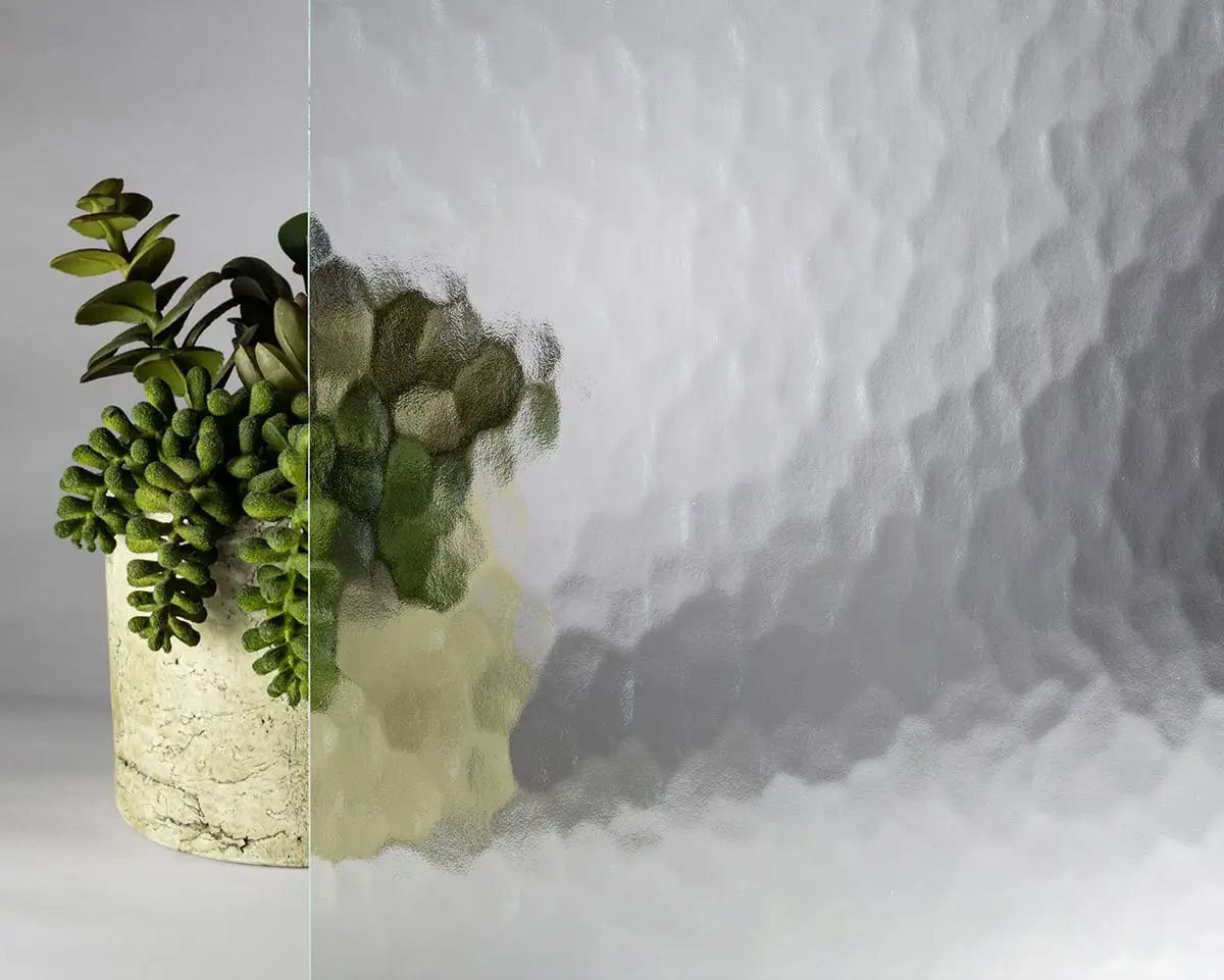 Detailed close-up of a decorative leaded glass window with textured and beveled glass panels.