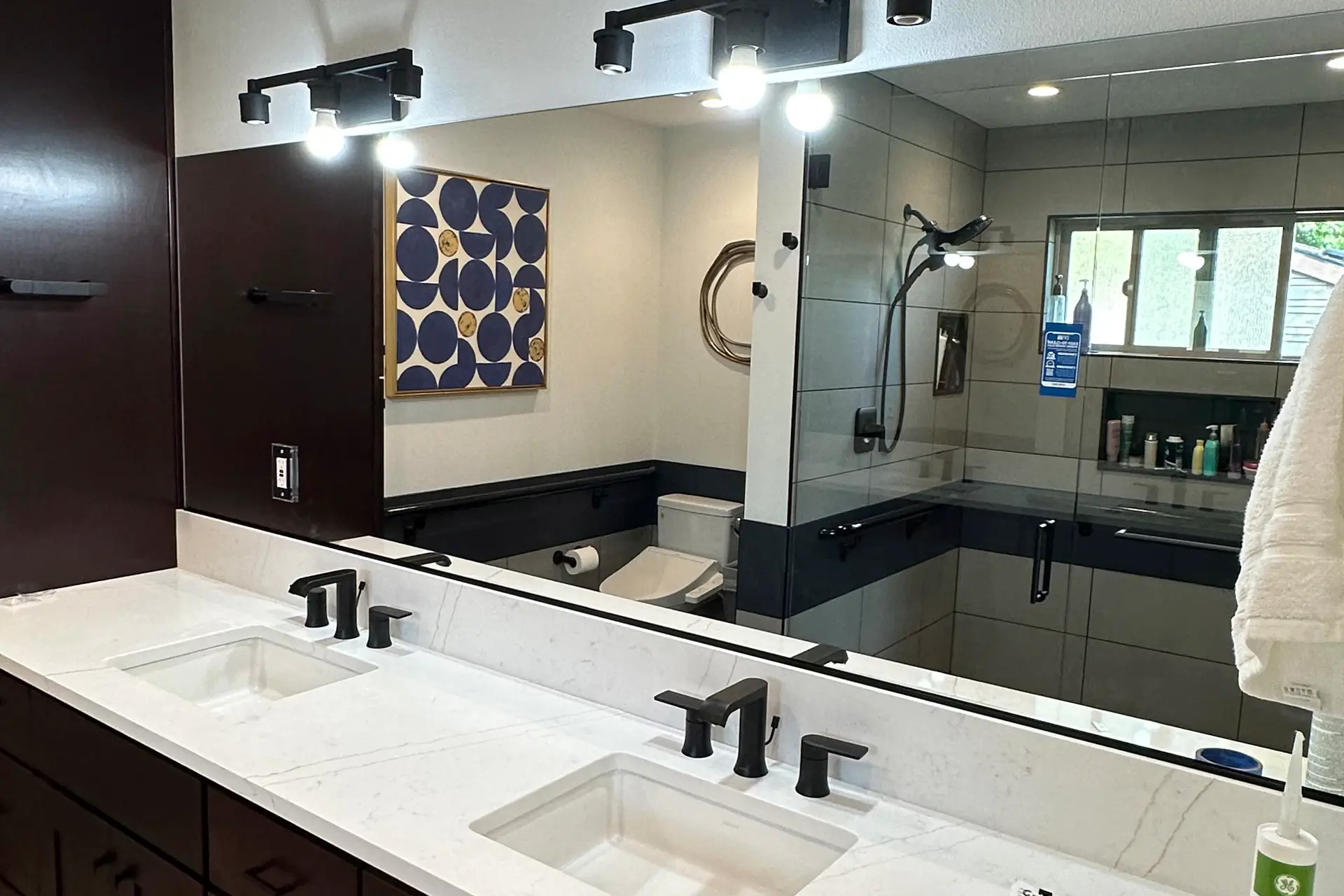 Bathroom mirror installation by Gresham Glass